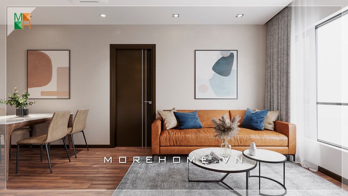 Giới thiệu mẫu ghế sofa bọc da bò nổi bật phù hợp với không gian phòng khách chung cư đơn giản, kết hợp mẫu bàn độc đáo 2 mặt tròn chồng lên nhau khiến căn phòng khách trở nên hiện đại và sang trọng hơn. Thiết kế phòng khách nhà phố